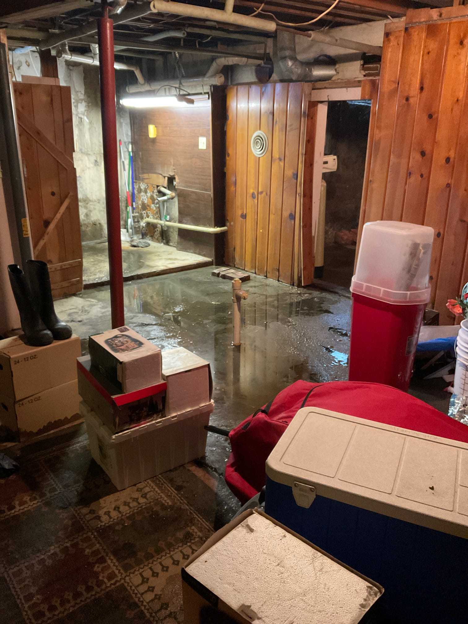 Wet walls and floor due to sewage backup 