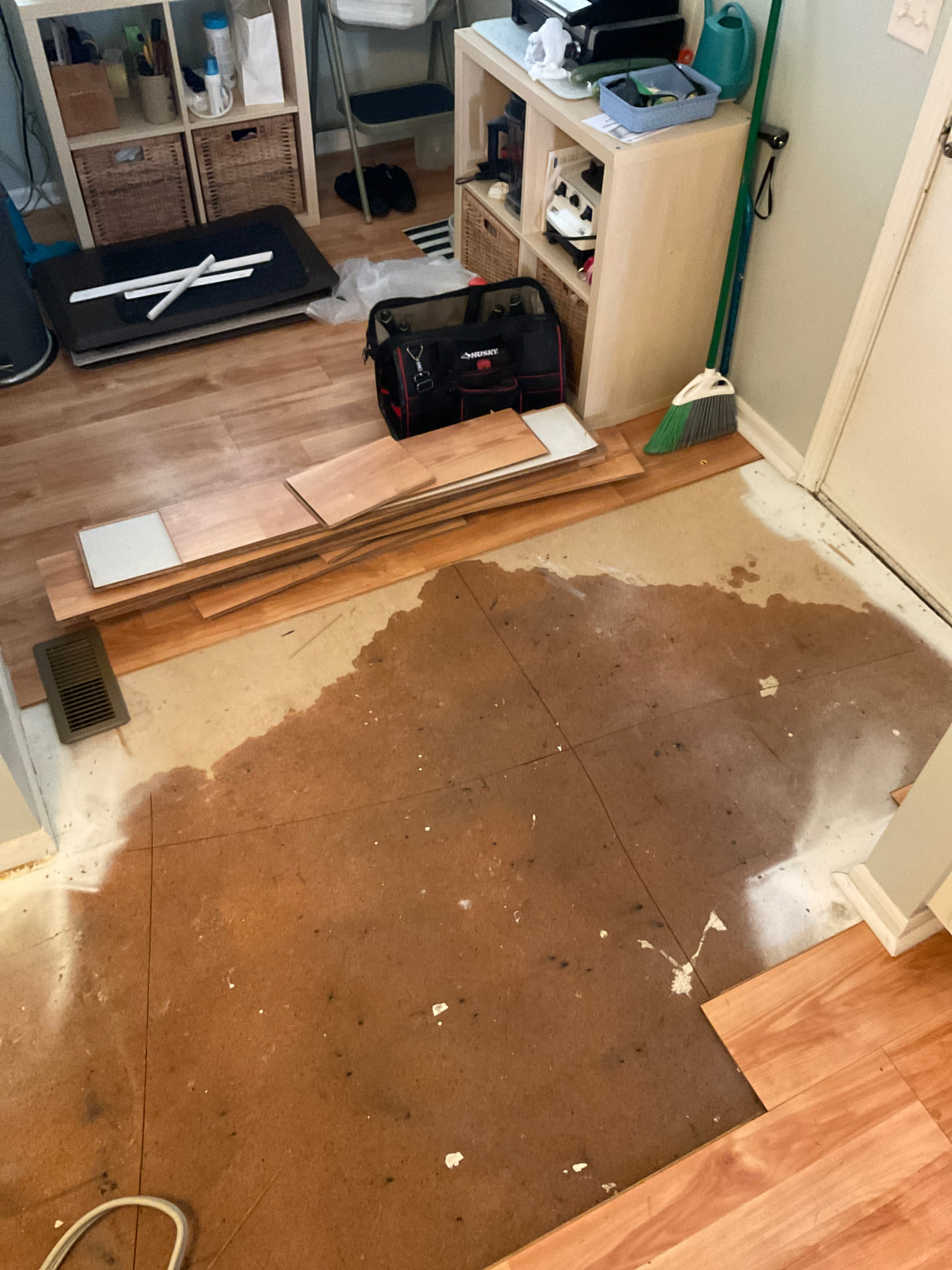 Removal of laminate flooring to properly dry kitchen 